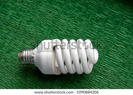 Light bulb on green background. Minimal concept. Copy space