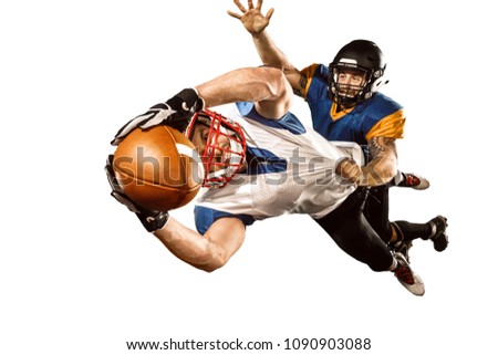 Active two american football player isolated on white background. Fit caucasian men in uniform with ball jumping over studio background in jump or motion. Super Bowl concept