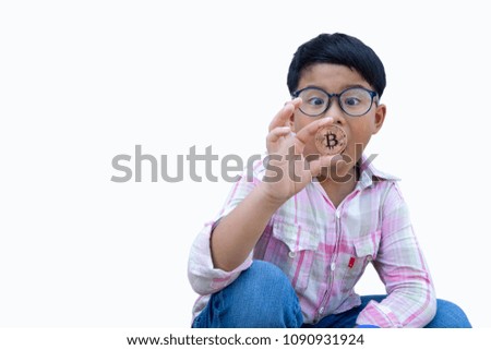Asian handsome boy sitting and holding a bitcoin, digital money in the future for next-generation.