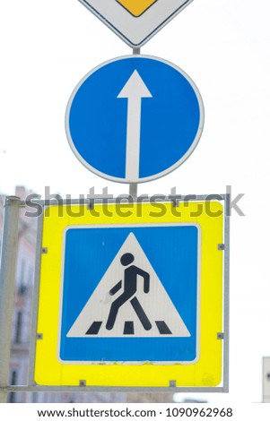 Road sign pedestrian crossing, travel straight and main road