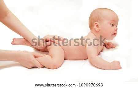 Picture of beautiful newborn baby on massage prosedure
