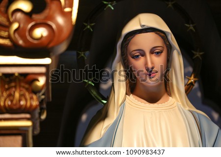 statue of virgin Mary our lady of grace Royalty-Free Stock Photo #1090983437