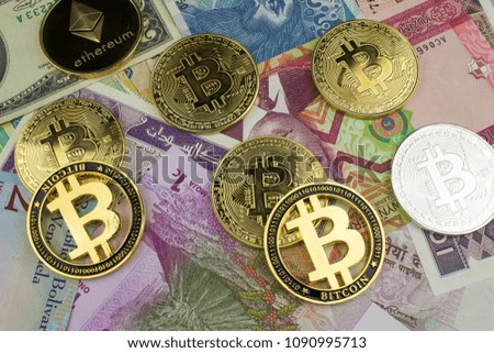 Bitcoin on paper money background. Fast growing virtual crypto currency .