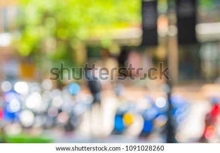 image of blur motorbike parking area in garden on day time with bokeh for background usage.