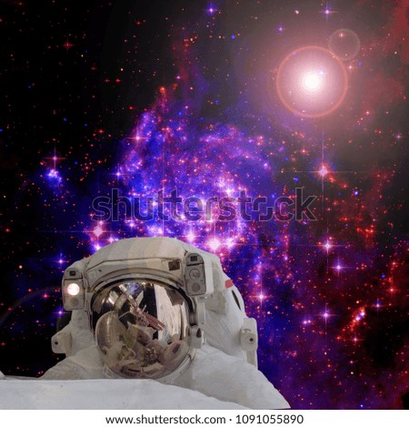 Astronaut and galaxies and stars. Space. The elements of this image furnished by NASA.