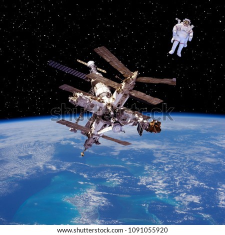 Astronaut and space station. Outer space, space walk. The elements of this image furnished by NASA.