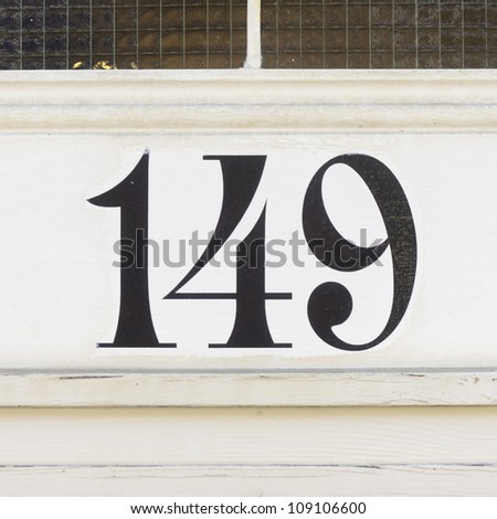 house number hundred and forty-nine. Decorative black lettering