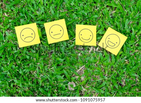 Sticky note paper with multiple drawing faces in different expressions