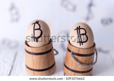 Egg with bitcoin in a wooden small barrel.