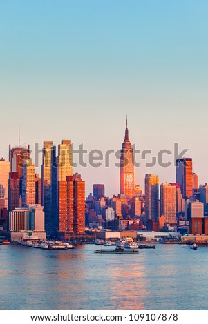 Manhattan Skyline illuminated by sunset
