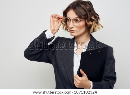  beautiful woman with glasses and a business suit                             