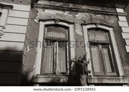 Ruined ancient windows in black and white photo