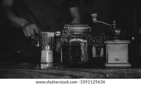Black and white picture Monochrome Barista Cafe Making Coffee Preparation with the original coffee blender Service Concept