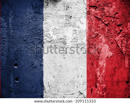 The French flag painted on grunge wall