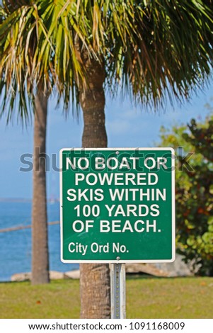 A Sign Saying No Boat or Powered Skis Within 100 Yards of Beach