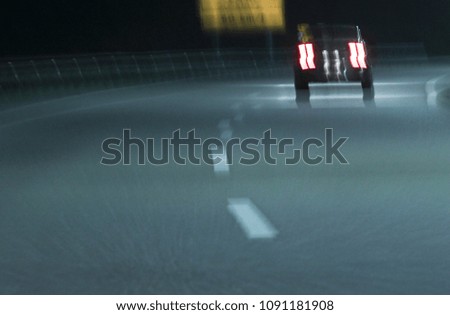 Abstract tones. Grain. Blurred. Night road and low speed shutter light at highway