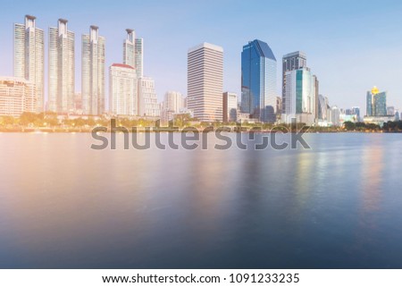 Office building with river front and clear blue sky background
