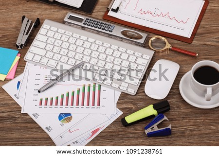 Items for business and accounting in the composition in the office on the table