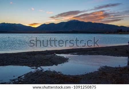 Sun rise at beautiful lake before lake Tekapo, Newzealand