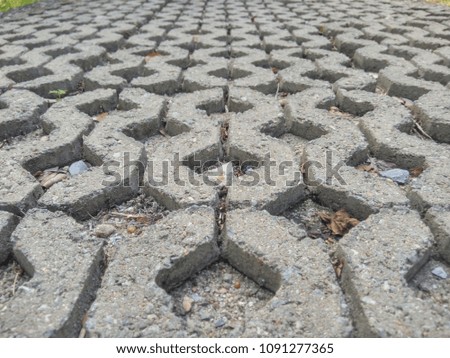 close up to hole pavement bricks those were constructed in horizontal directions