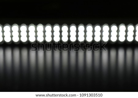 The red light reflected on the black floor.Abstract background,LED light bar,Blur Bokeh                               