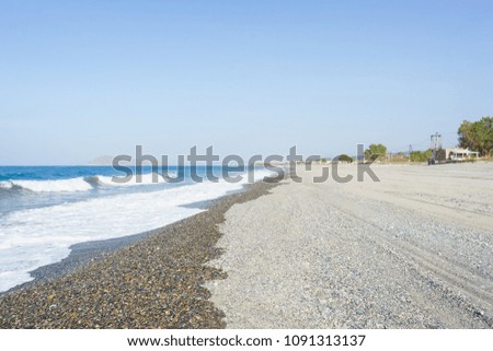 Seascape. Beautiful empty pebbles beach - serenity and peace in the journey. Pebbles and small stones. Travel to the sea.