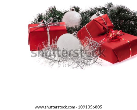 red gifts with silver tinsel isolated on white background
