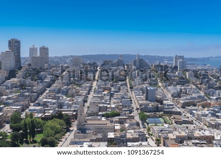 San Francisco, panorama of Telegraph Hill, Washington Square, Russian Hill and Saints Peter and Paul church, and the Golden Gate Bridge in background
