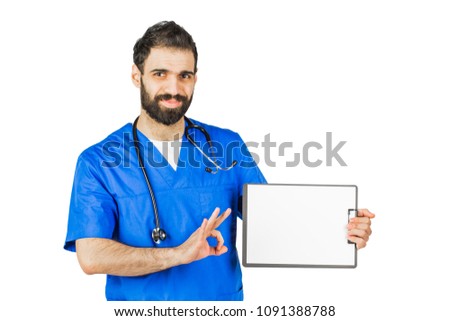 Doctor in blue robe with stethoscope pointing to clipboard isolated on white background.