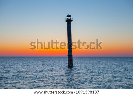 Iconic falling Kiipsaare lighthouse at sunset light, island of Saaremaa, Estonia.