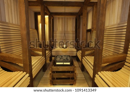 Sauna room with traditional sauna accessories Royalty-Free Stock Photo #1091413349