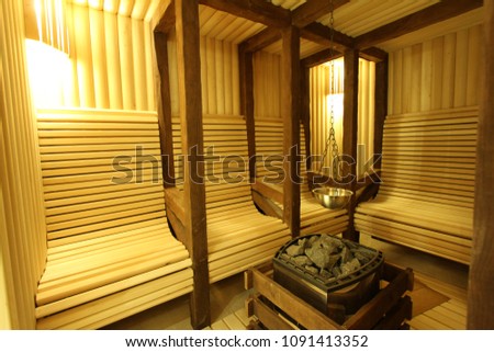 Sauna room with traditional sauna accessories Royalty-Free Stock Photo #1091413352