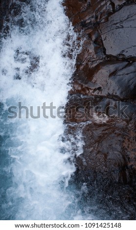 A stream coming through a rock on Mount Ruapehu in New Zealand