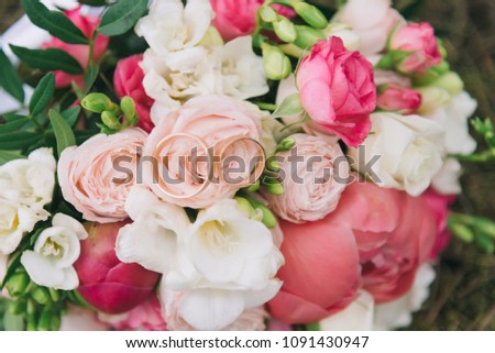 Bouquet of flowers. The bride's bouquet. Bridal bouquet. Floristics. Wedding rings. Wedding bouquet from different colors.