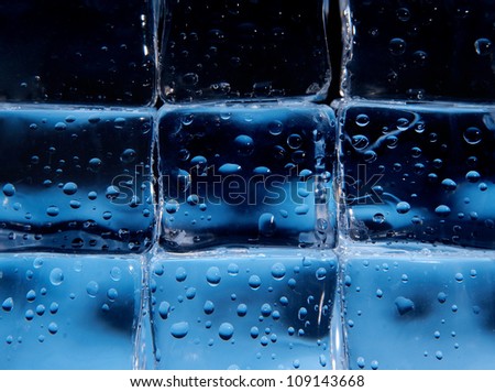 Wall made of ice cubes with drops