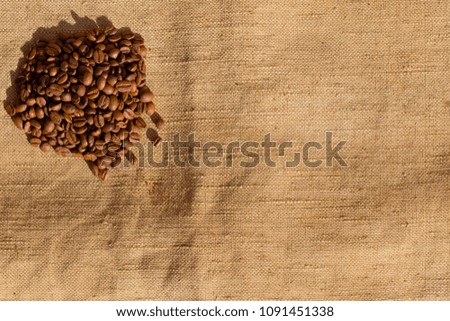 coffee beans on linen cloth. Flatlay. Copy space