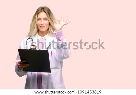 Young doctor woman, medical professional doing ok sign gesture with both hands expressing meditation and relaxation