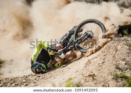 Spectacular crash during fast ride on a mountain bike. Royalty-Free Stock Photo #1091492093