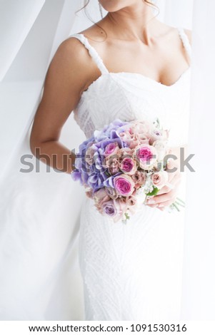 Wedding bouquet of the bride in hand. Beautiful wedding bouquet for bride. Royalty-Free Stock Photo #1091530316