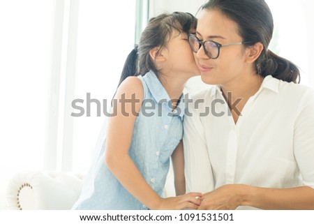 Happy loving family. Mother and her daughter child girl playing and hugging.