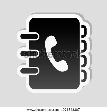 address book with phone sign on cover. simple icon. Sticker style with white border and simple shadow on gray background