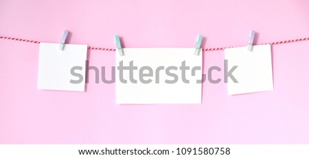 Blank white papers notepad hanging on pink background, banner for text