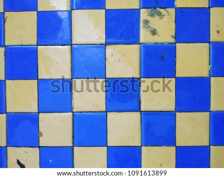 Chessboard with blue and yellow color top view on table
