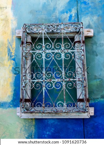 Window Grill on Colorful Wall
