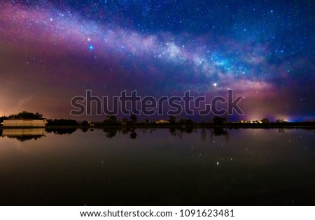 Night Astrophotography: Milky way over rice fields in Delta de Ebro natural park, Tarragona, Catalonia, Spain