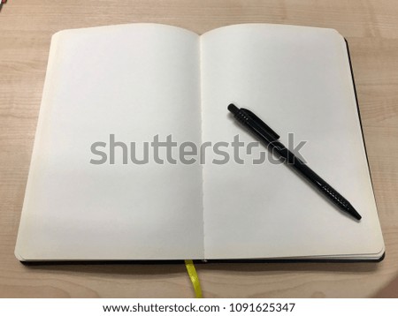 Blank white page book with pen