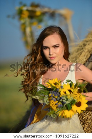 village girl bride with a bouquet of flowers