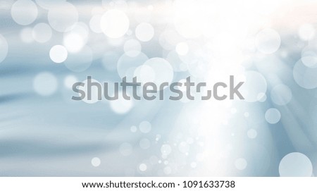 white blur on blue abstract background. bokeh christmas blurred beautiful shiny Christmas lights