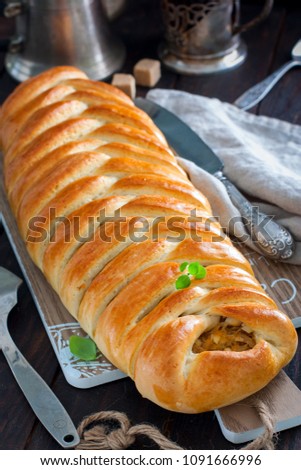 Kulebyaka with cabbage, traditional pie in Russian cuisine, selective focus