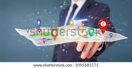 View of a Businessman holding a 3d rendering pin holder on a map